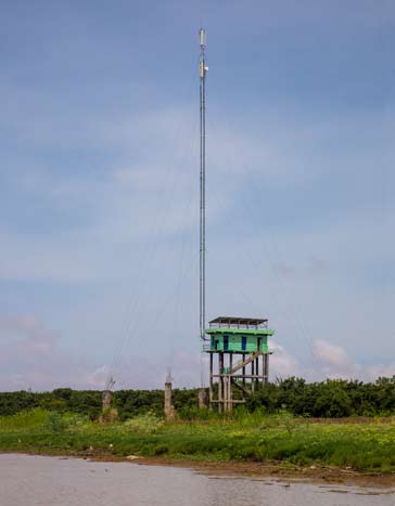 4G LTE Base station and antenna in Tonle Sap Cambodia - base station is on stilts as the lake level rises considerably in the wet season