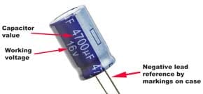 Leaded aluminium electrolytic capacitor showing the negative connection marking.