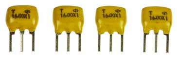 Ceramic passband filters showing the three connection pins - input, output, common - these devices are also available in a surface mount technology format