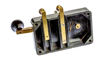 View of Clipsal Morse key showing the nuderside and the connections