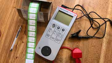 Typical PAT tester on a bench ready for testing portable electrical appliances